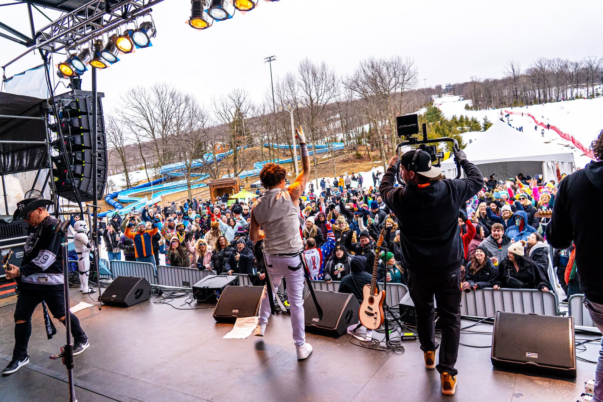 View from the Mountainfest stage toward the crowd and snowy slopes